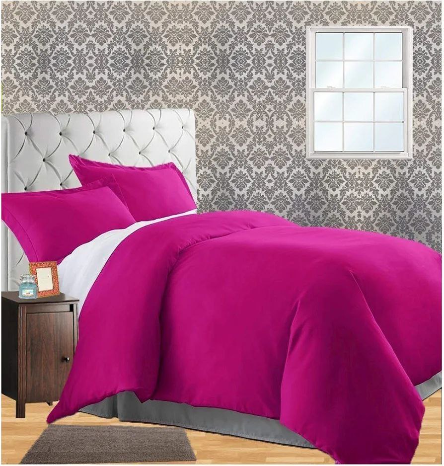 Chic bedroom featuring a vibrant magenta duvet and matching pillows on a tufted headboard, set against an elegant patterned wallpaper. A bold duvet for a luxurious bedroom feel.