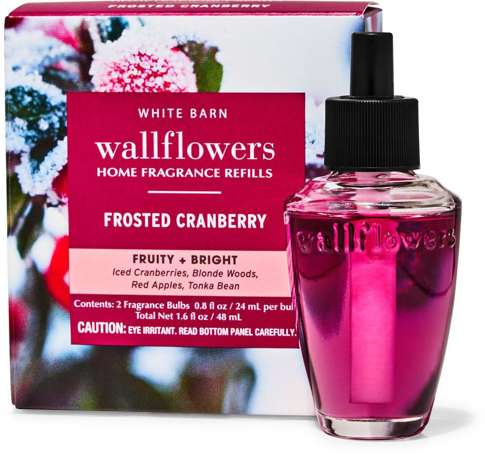 Bath and Body Works White Barn Wallflowers home fragrance refill in Frosted Cranberry scent, featuring a vibrant pink bottle with fruity and bright notes.