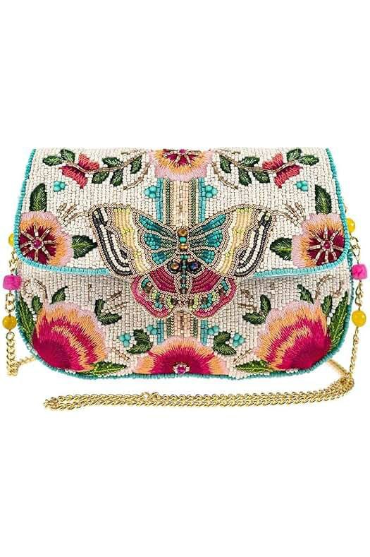 Colorful beaded bag with intricate butterfly and floral designs, featuring vibrant pink, green, and turquoise details and a gold chain strap, ideal for adding a bold, artistic touch to any outfit.